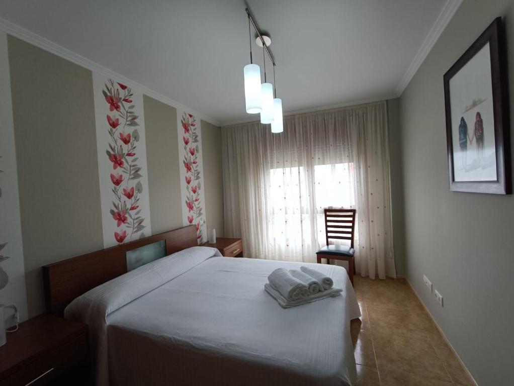 Postel nebo postele na pokoji v ubytování Apartamento Isla de Arousa - Riasón