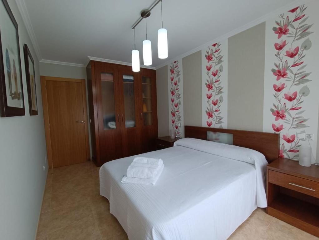 Postel nebo postele na pokoji v ubytování Apartamento Isla de Arousa - Riasón