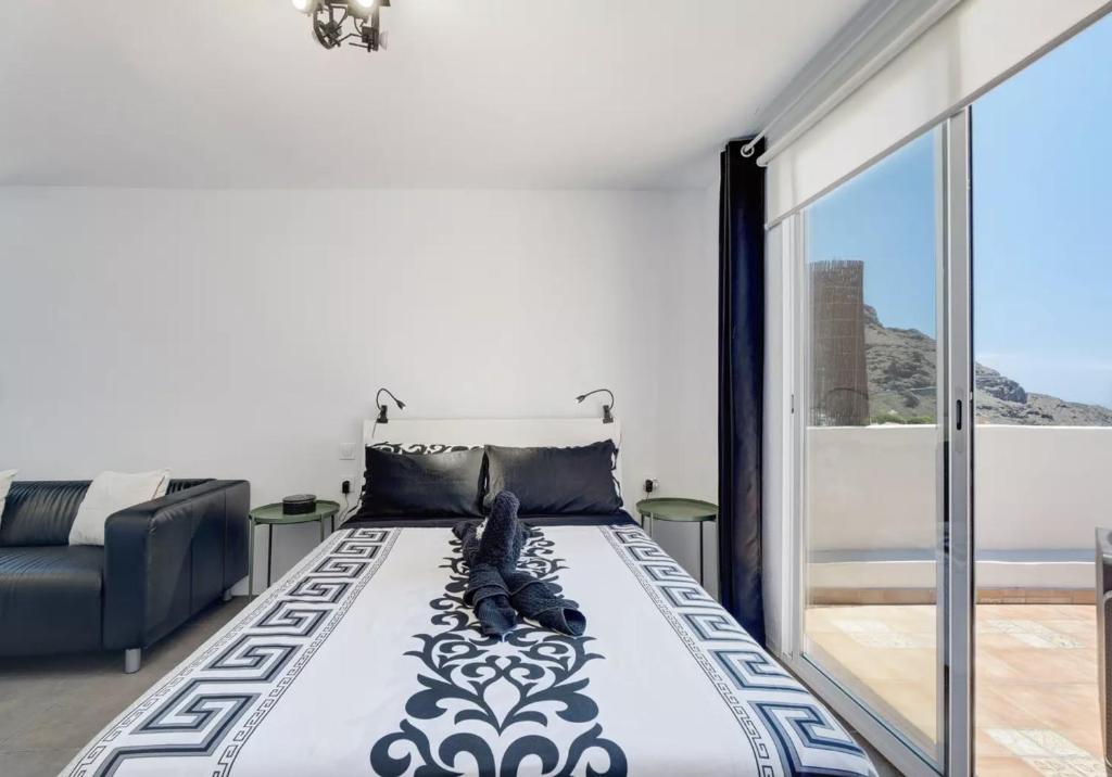 Postel nebo postele na pokoji v ubytování Yinfa 1 Sunset Apartment