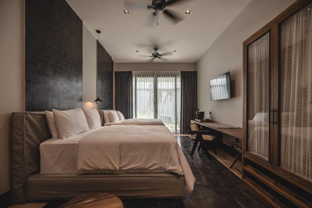 Postel nebo postele na pokoji v ubytování Hotel Sutuk