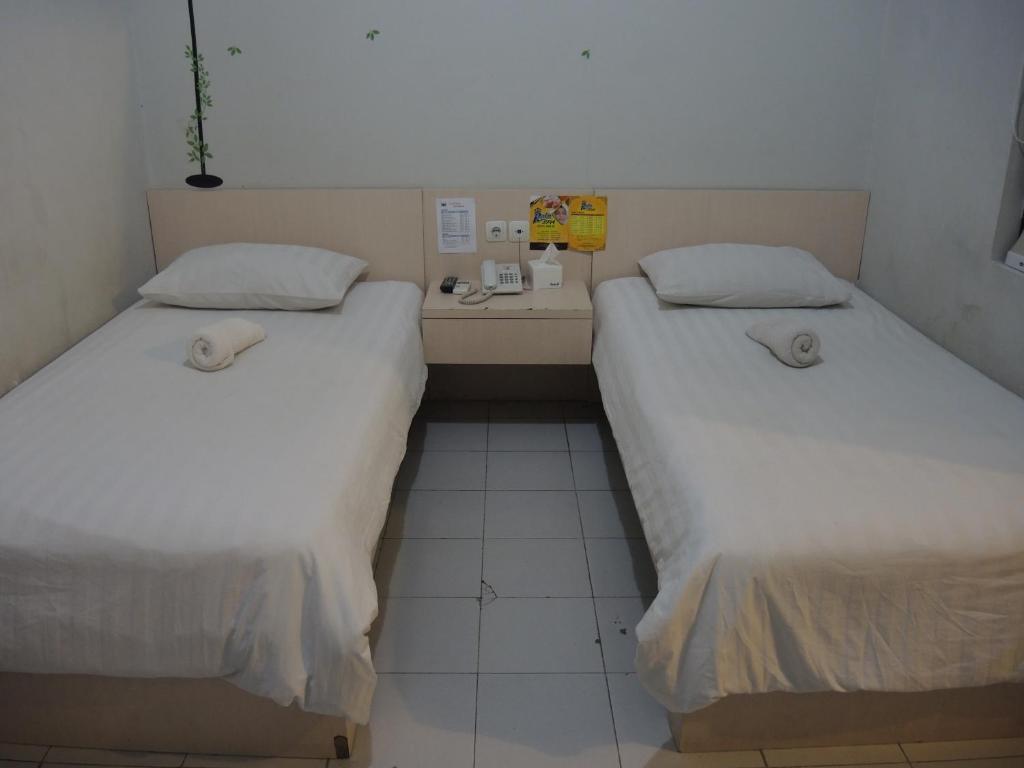 Postel nebo postele na pokoji v ubytování SWK 95 Hotel
