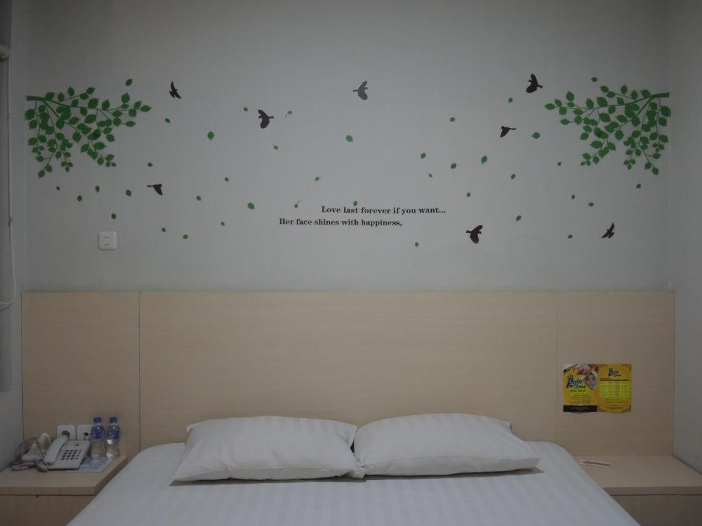 Postel nebo postele na pokoji v ubytování SWK 95 Hotel