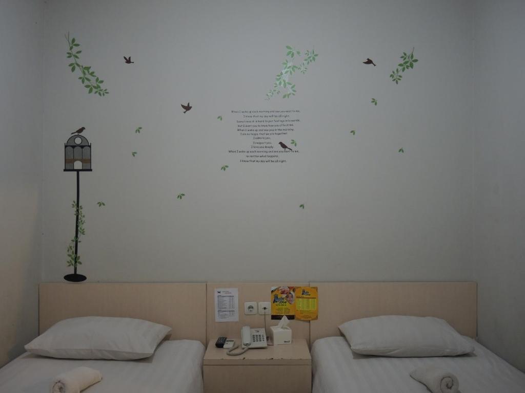 Postel nebo postele na pokoji v ubytování SWK 95 Hotel