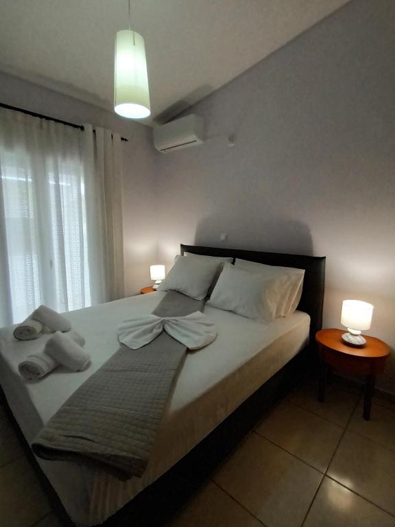 Postel nebo postele na pokoji v ubytování Nikolas home