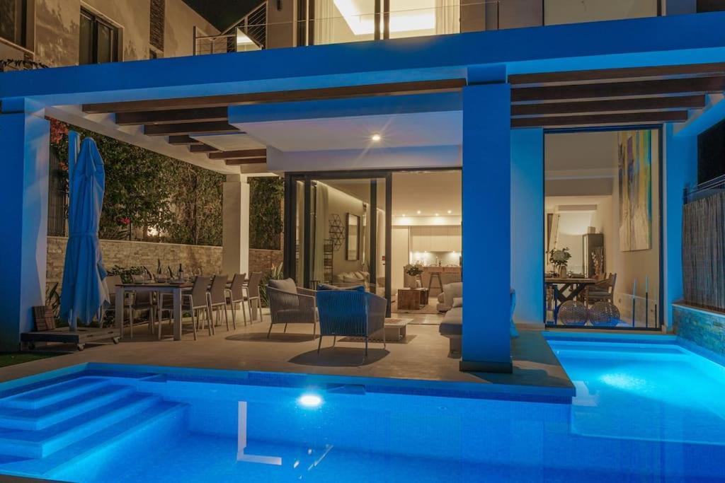 a house with a swimming pool at night at Amazing villa in Green Hill Marbella in Mijas