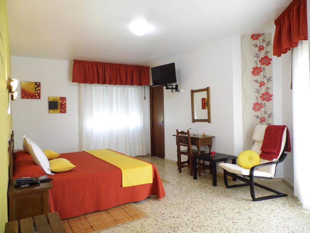 Postel nebo postele na pokoji v ubytování Hotel Arboleda