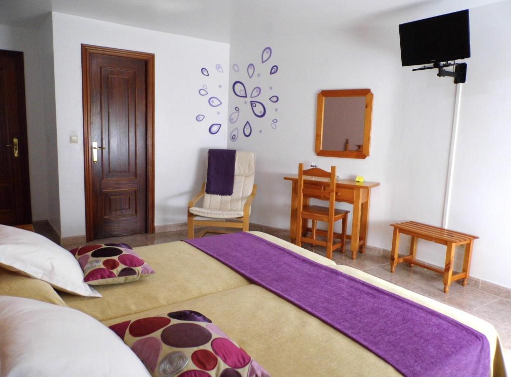 Postel nebo postele na pokoji v ubytování Hotel Arboleda