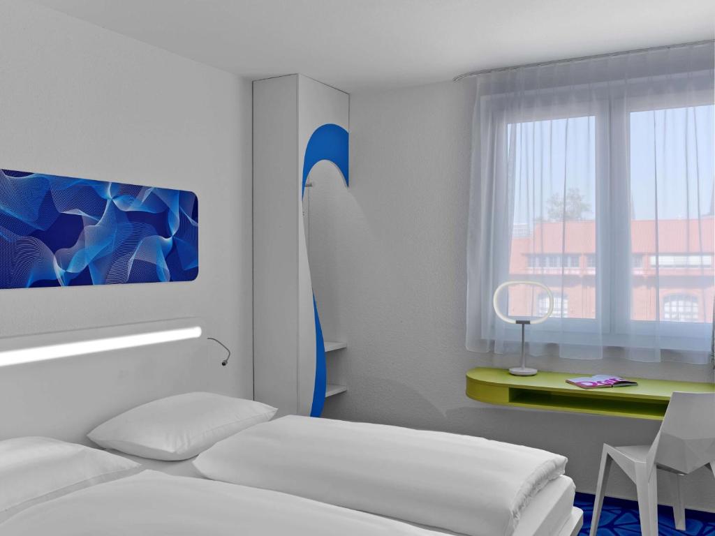 Postel nebo postele na pokoji v ubytování Prize by Radisson, Hamburg City