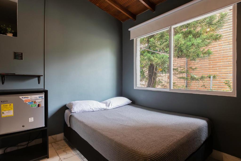 Postel nebo postele na pokoji v ubytování Living Hotel