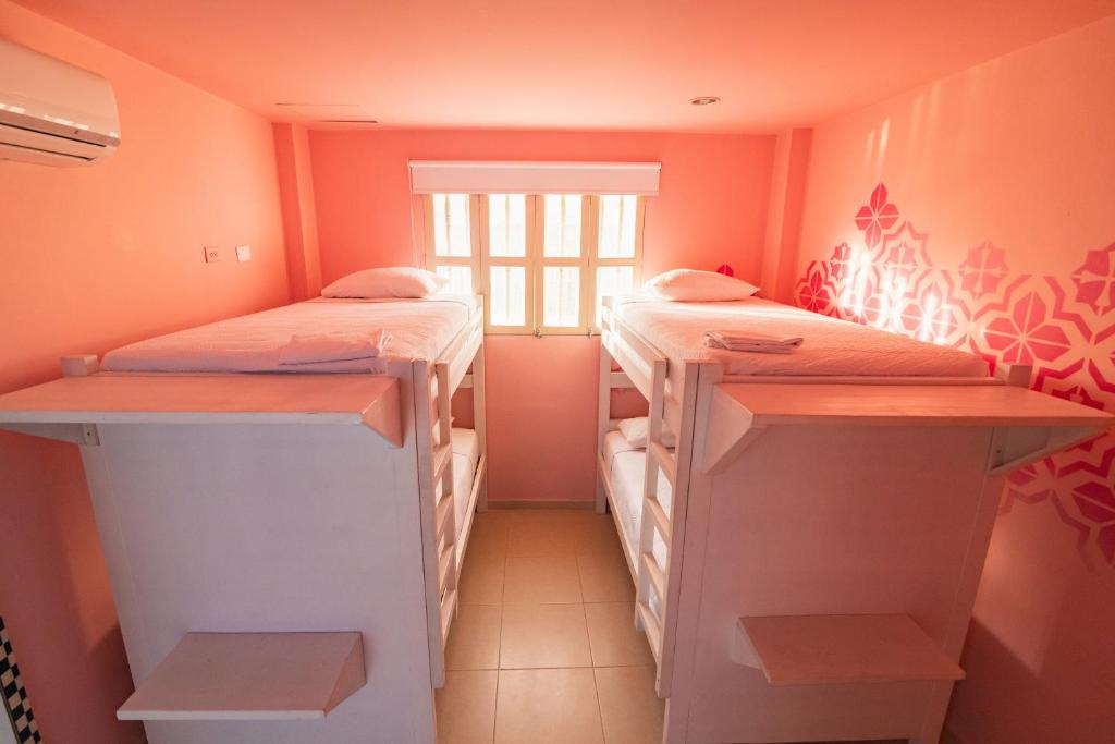Postel nebo postele na pokoji v ubytování San Felicin Hostel