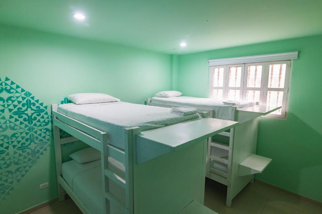 Postel nebo postele na pokoji v ubytování San Felicin Hostel