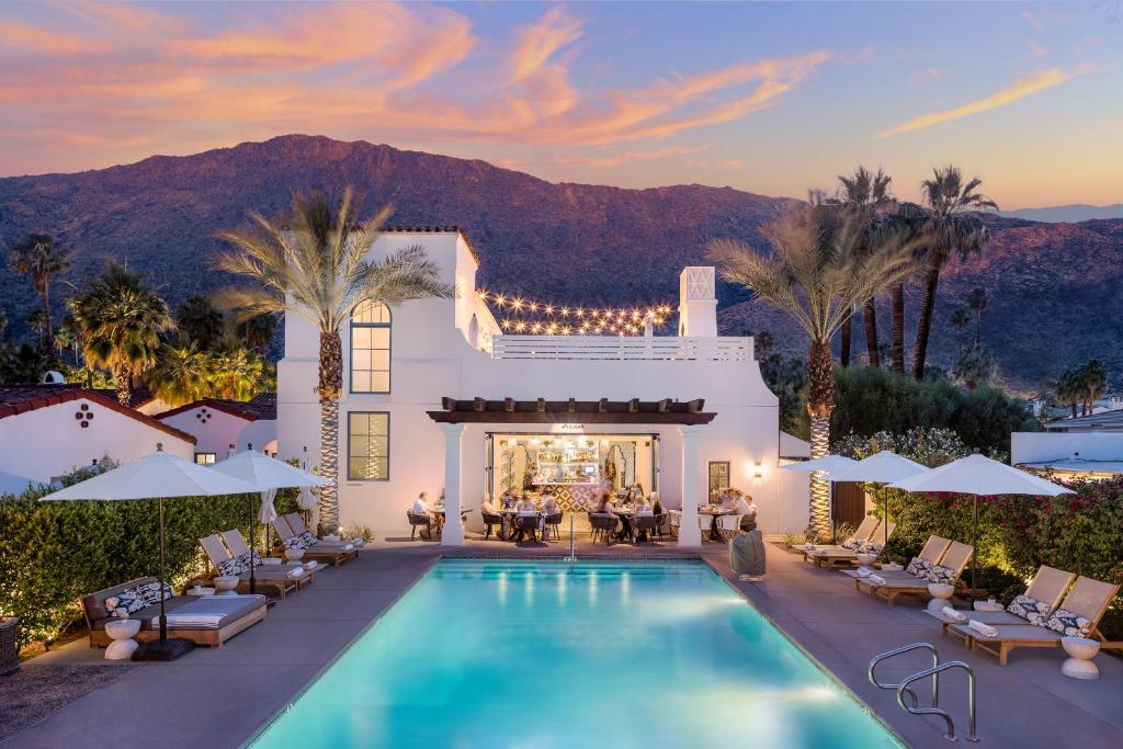 a villa with a swimming pool and a resort at La Serena Villas, A Kirkwood Collection Hotel in Palm Springs