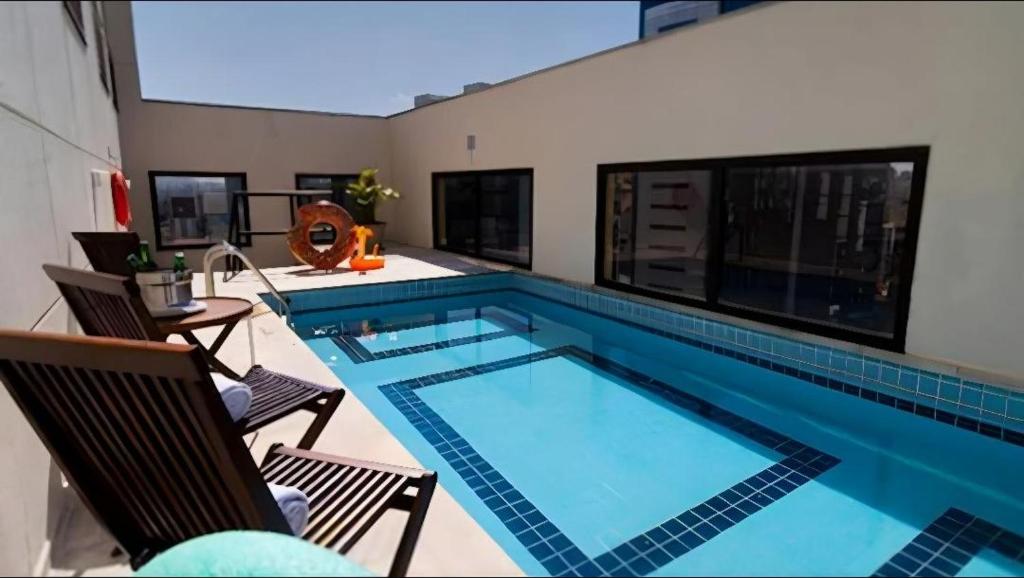 Bazén v ubytování Q-Flat Hotel - Faria Lima nebo v jeho okolí