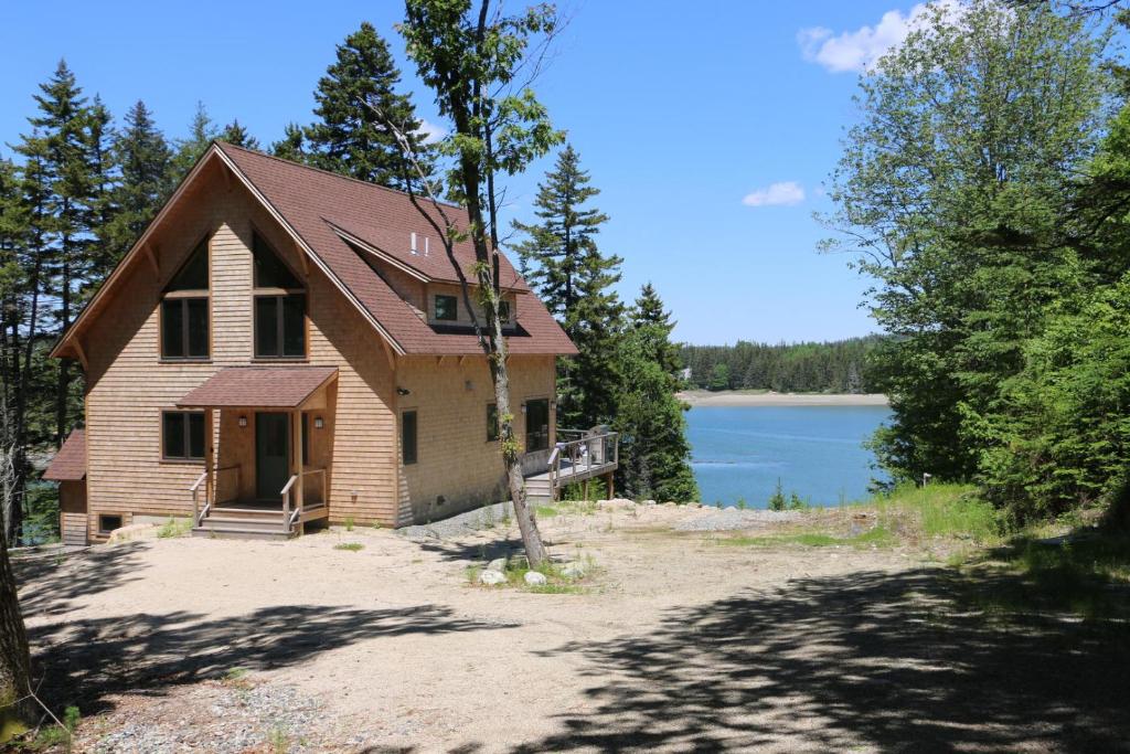 a house on the shore of a lake at Poseidon in Deer Isle