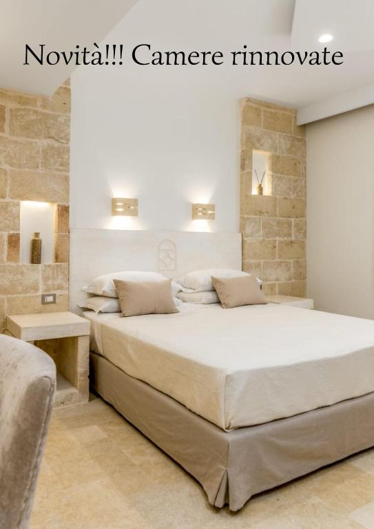 Postel nebo postele na pokoji v ubytování Relais Porta del Sud