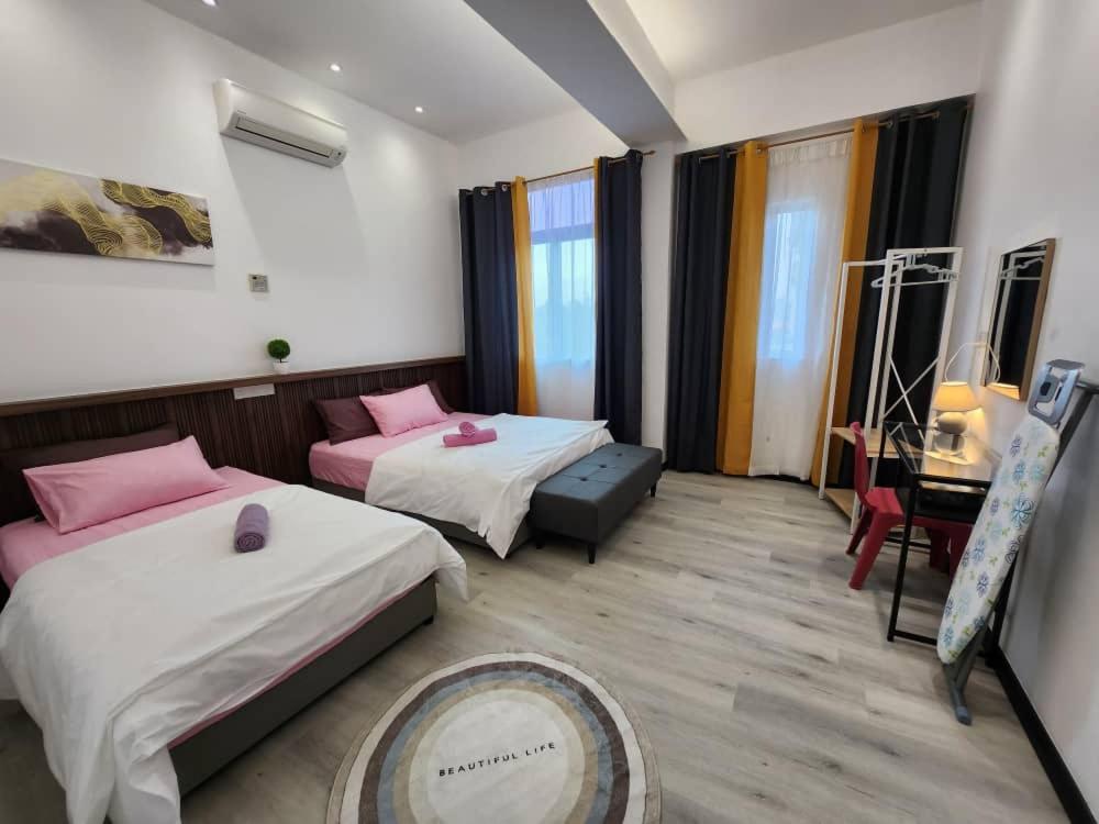 Postel nebo postele na pokoji v ubytování One Point Inn King Centre
