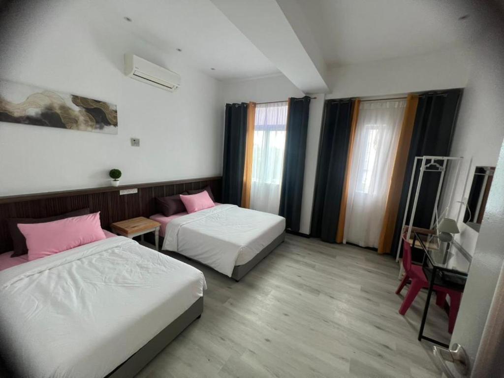 Postel nebo postele na pokoji v ubytování One Point Inn King Centre