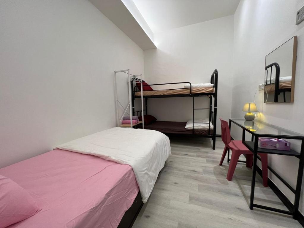 Postel nebo postele na pokoji v ubytování One Point Inn King Centre