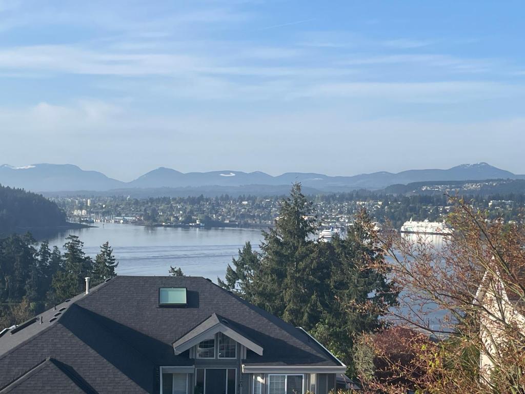 a house with a view of a body of water at Panoramic Ocean View in Nanaimo