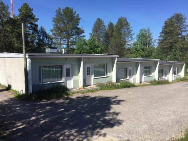 a row of modular homes in a parking lot at Posio Apartments in Posio