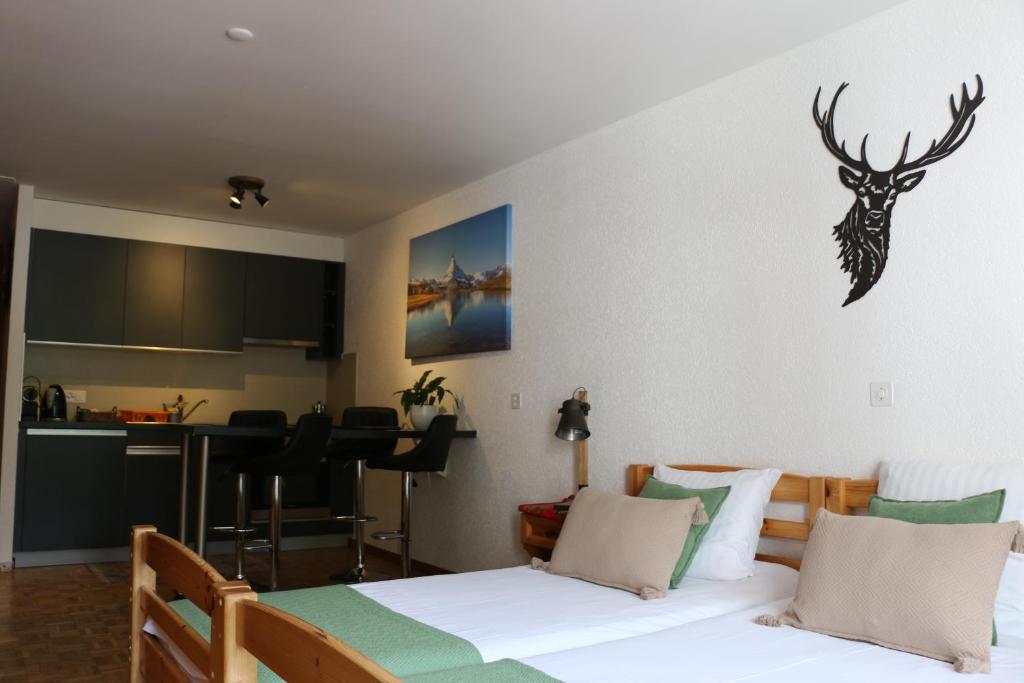 Postel nebo postele na pokoji v ubytování Le Vieux Valais