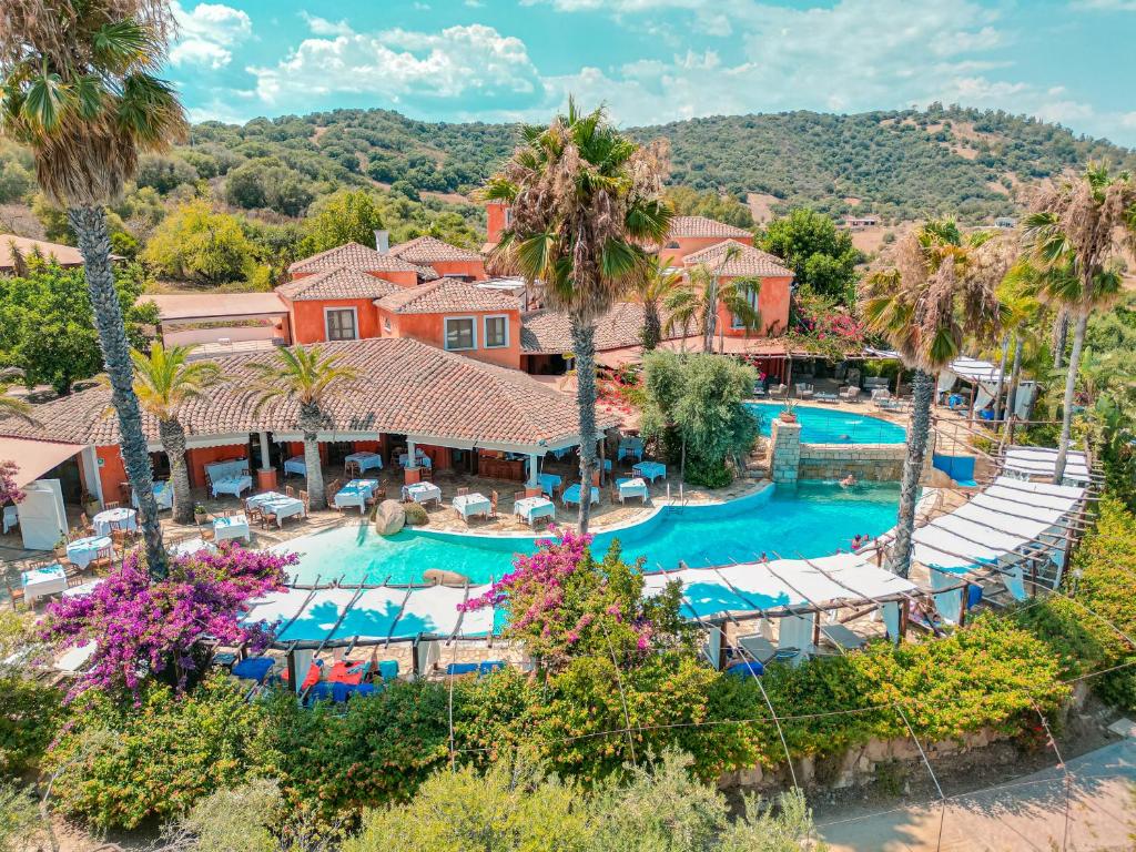 an aerial view of a resort with a swimming pool at Hotel Galanias in Bari Sardo