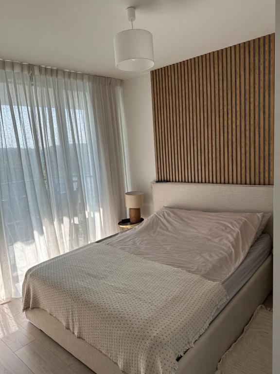 Posteľ alebo postele v izbe v ubytovaní Wave Resort & Spa Magic Apartaments with sea view