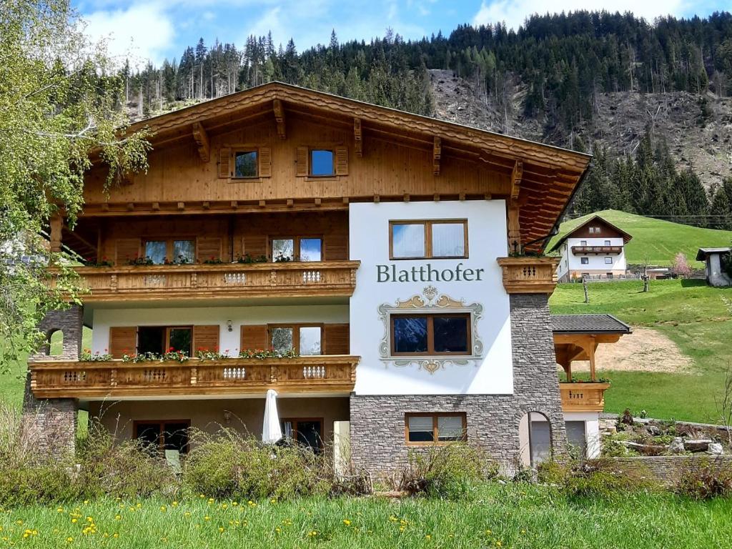 a building with a sign that reads blair brother at Haus Blatthofer in Sankt Lorenzen im Lesachtal