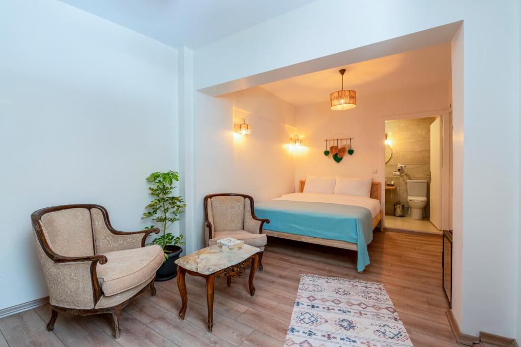 Postel nebo postele na pokoji v ubytování Aya Butik Otel