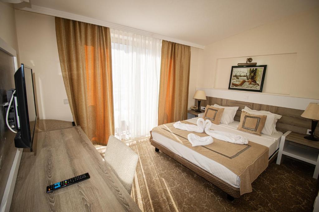 Postel nebo postele na pokoji v ubytování RK MAGİC DREAM HOTEL