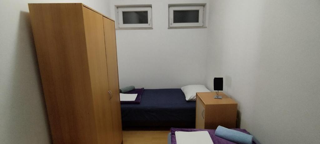 Postel nebo postele na pokoji v ubytování Apartment Štrbić