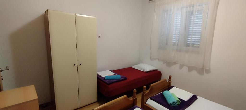 Postel nebo postele na pokoji v ubytování Apartment Štrbić