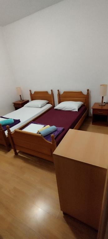Postel nebo postele na pokoji v ubytování Apartment Štrbić