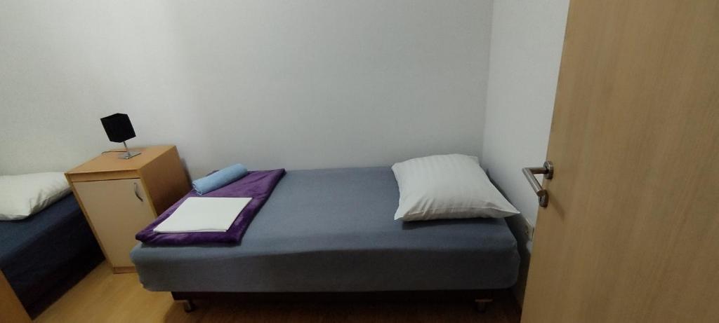 Postel nebo postele na pokoji v ubytování Apartment Štrbić