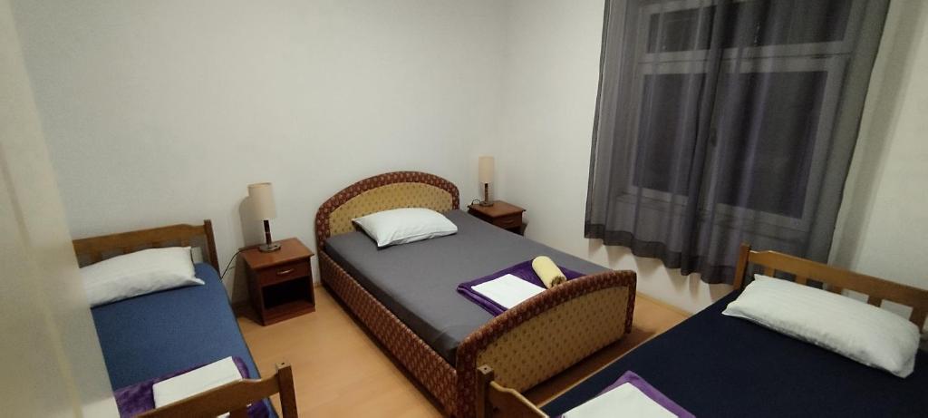 Postel nebo postele na pokoji v ubytování Apartment Štrbić