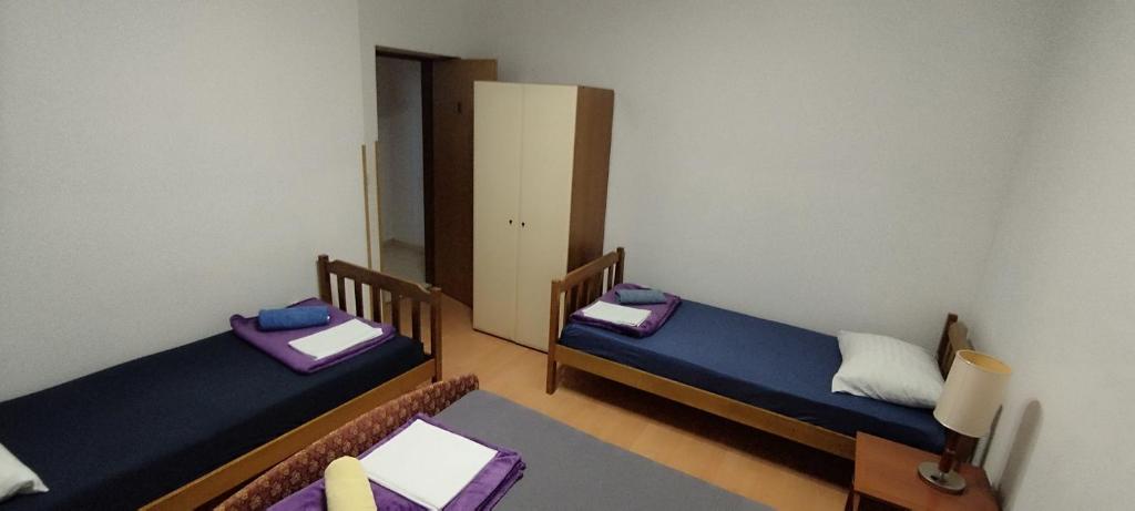 Postel nebo postele na pokoji v ubytování Apartment Štrbić