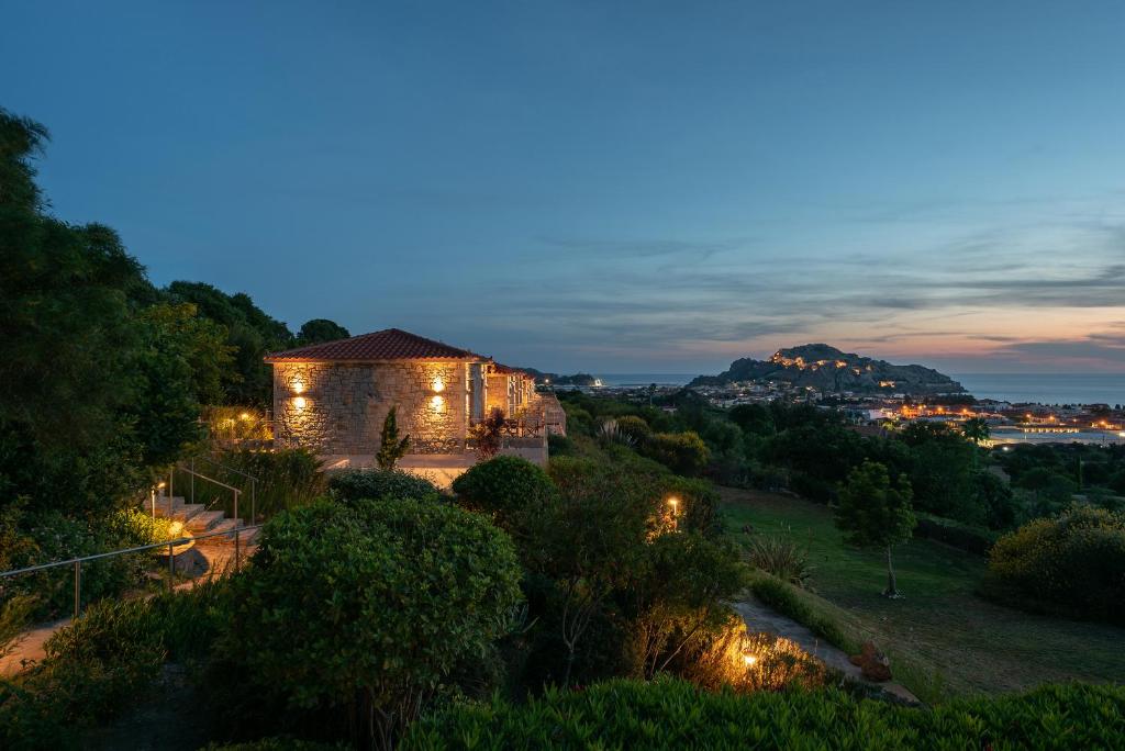 a house lit up at night with lights at Amigdalies in Myrina