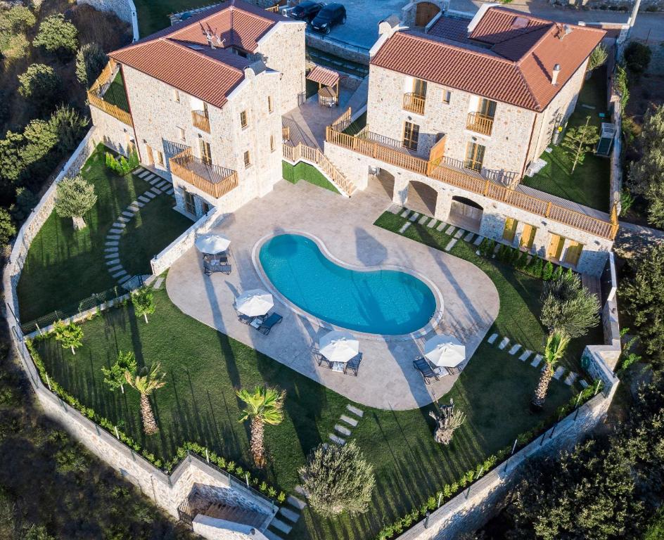 an aerial view of a house with a swimming pool at ZEYT INN HOTEL in Datca
