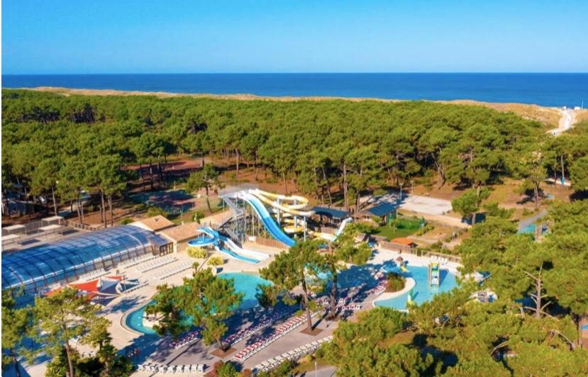 an aerial view of a water park with a water slide at Spacieux Mobilhome Premium/Camping 5* in Vendays-Montalivet