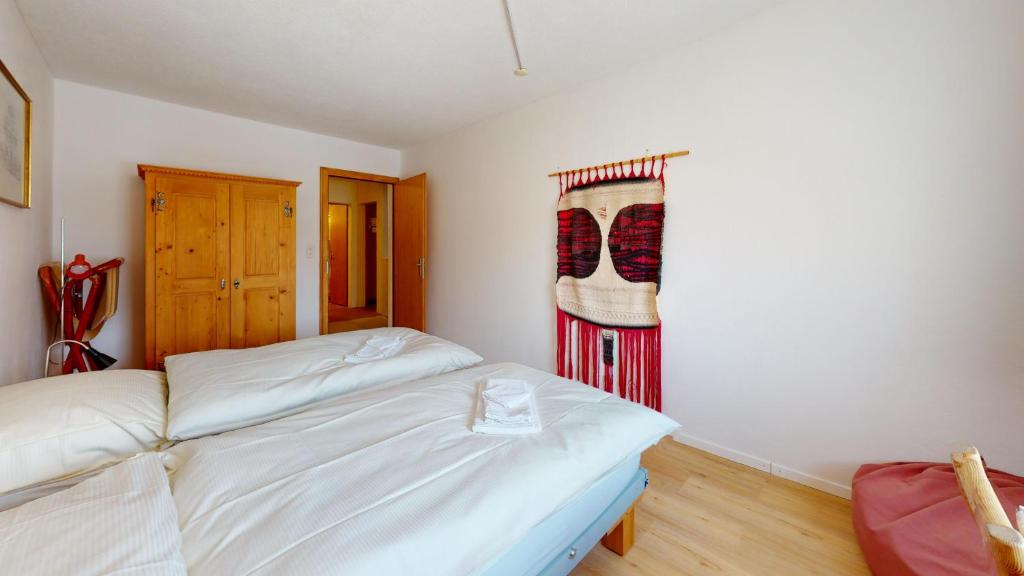 Postel nebo postele na pokoji v ubytování Abitaziun Sur Vih - Samedan
