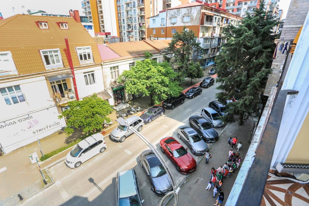 an aerial view of a city street with cars parked at Eiffel Hotel in Batumi