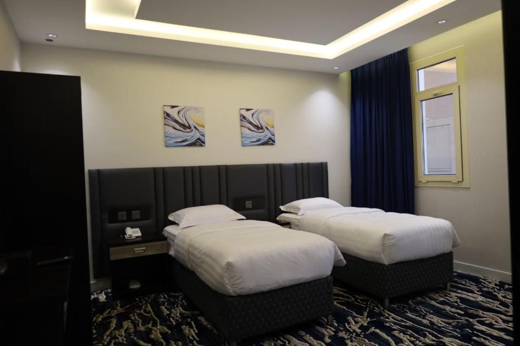 Postel nebo postele na pokoji v ubytování فندق قمم بارك Qimam Park Hotel 6