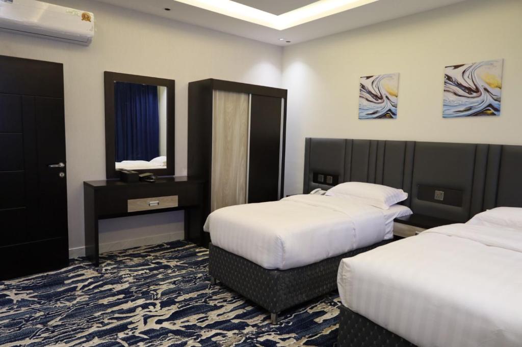 Postel nebo postele na pokoji v ubytování فندق قمم بارك Qimam Park Hotel 6