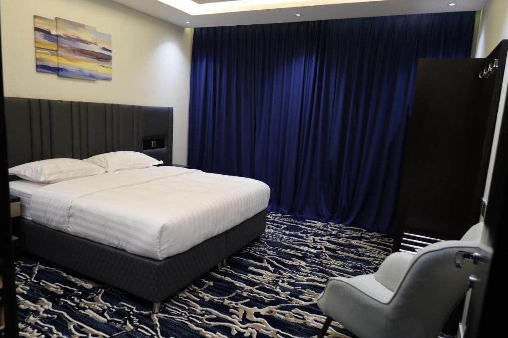 Postel nebo postele na pokoji v ubytování فندق قمم بارك Qimam Park Hotel 6