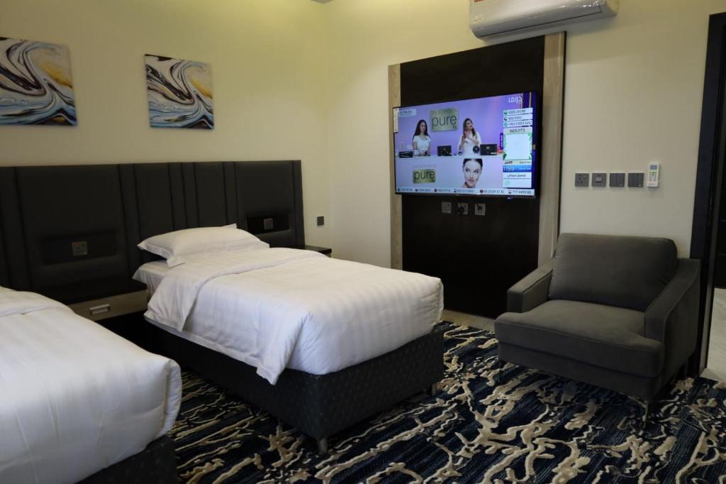 Postel nebo postele na pokoji v ubytování فندق قمم بارك Qimam Park Hotel 6