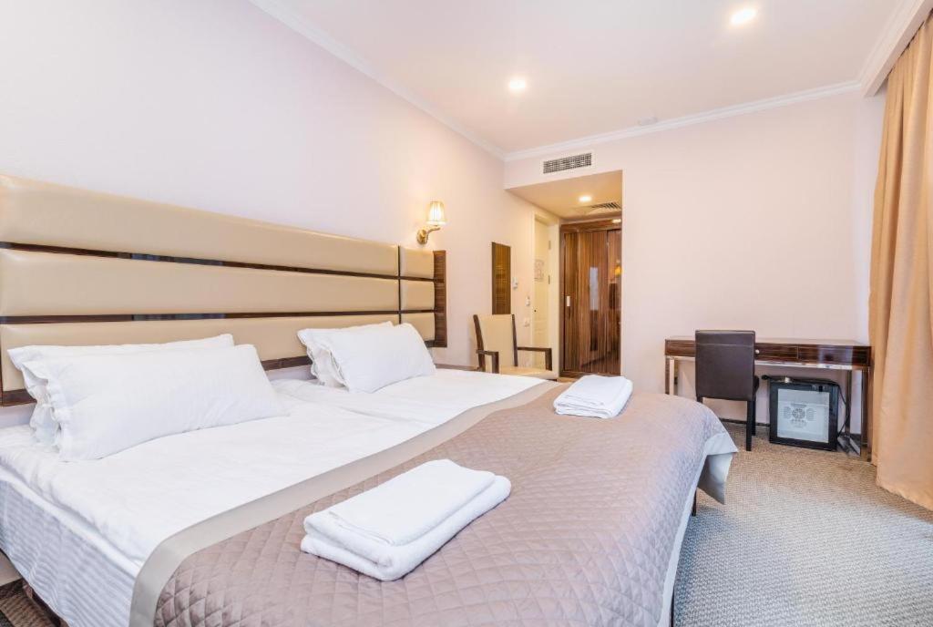 Postel nebo postele na pokoji v ubytování Hotel Genio