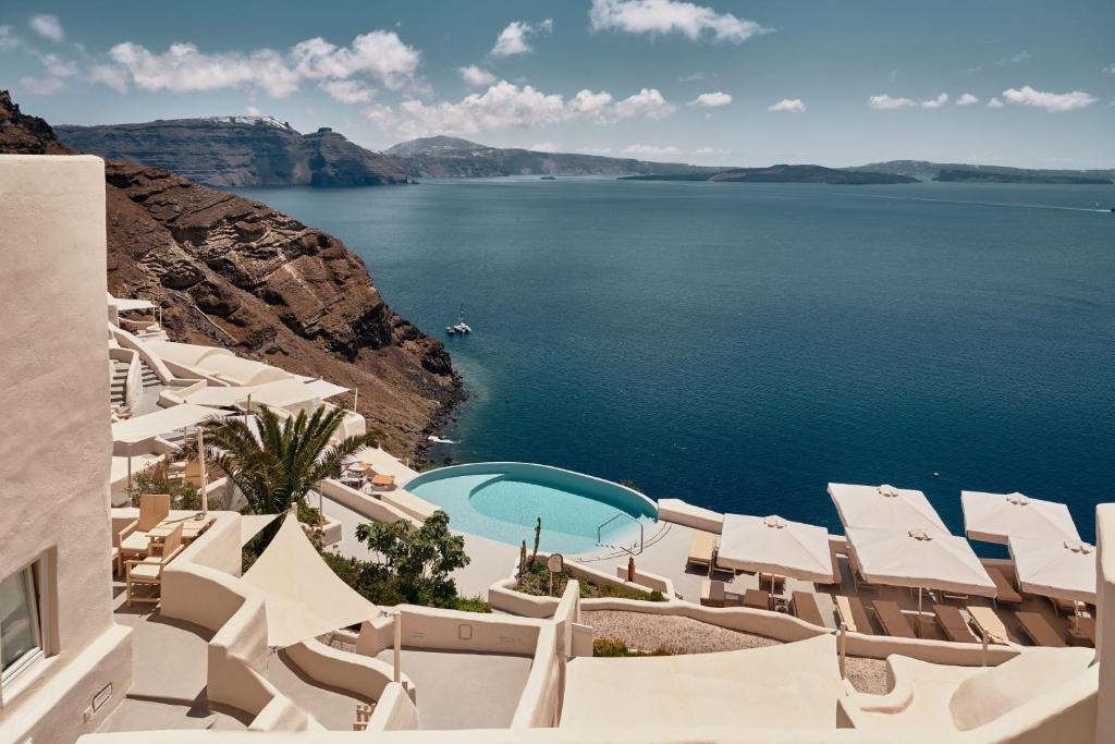 a view of the ocean from a resort at Mystique, a Luxury Collection Hotel, Santorini in Oia