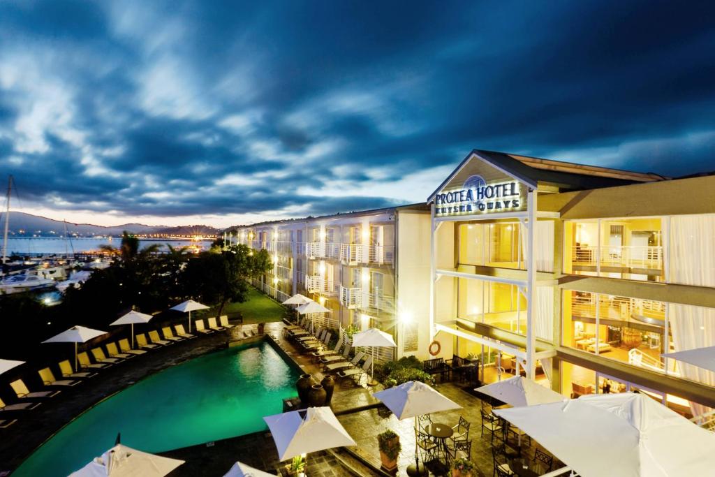 a view of a hotel with a swimming pool at Protea Hotel by Marriott Knysna Quays in Knysna