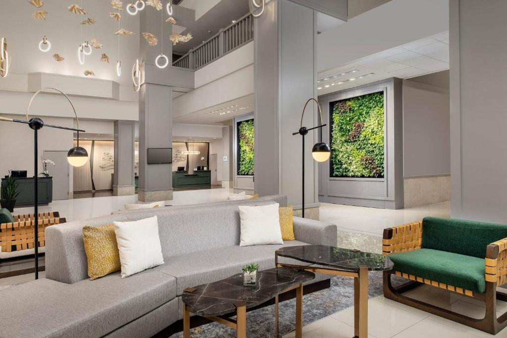 a living room with a couch and a table at The Westin Dallas Fort Worth Airport in Irving