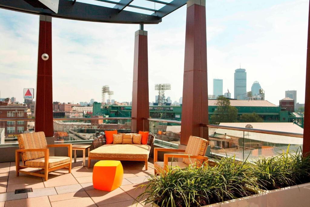 a balcony with chairs and a view of a city at Residence Inn by Marriott Boston Back Bay/Fenway in Boston